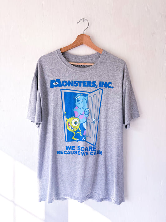 Monster’s Inc ‘Scare BC We Care’ Tee - L